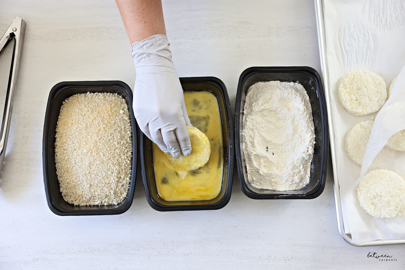 Dipping a rice cake into egg