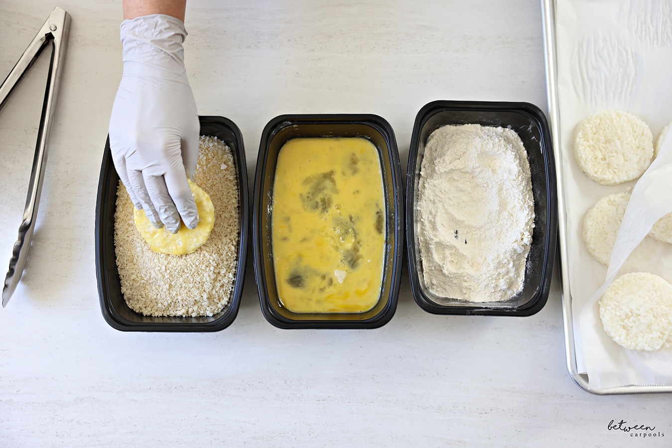 Dipping a rice cake into panko crumbs.