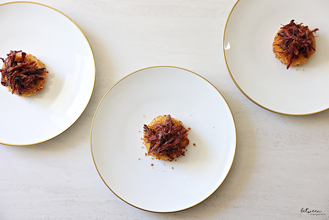 Pastrami topped rice cakes - individually plated.