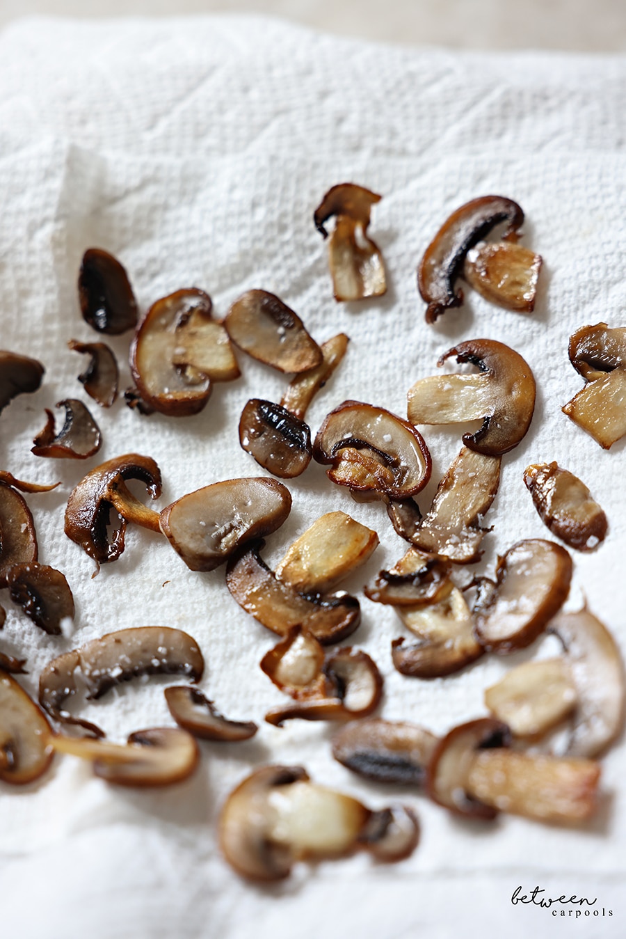 Sautéed mushrooms on paper towel.