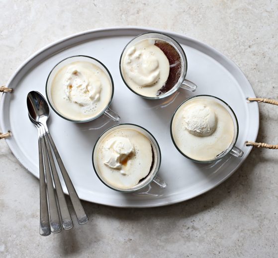 Top view of affogato coffee dessert in glass teacups on a tray.