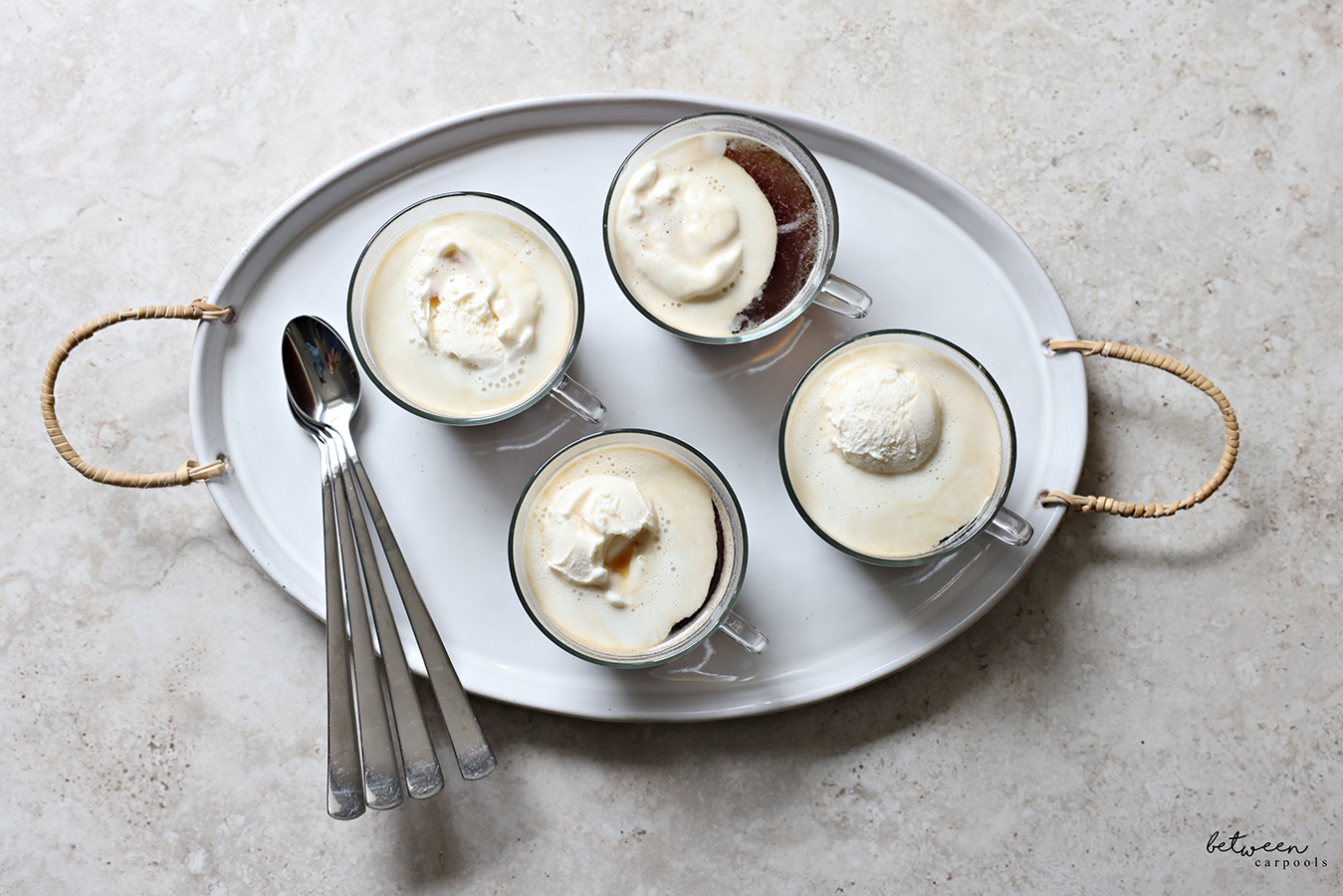 Top view of affogato coffee dessert in glass teacups on a tray.