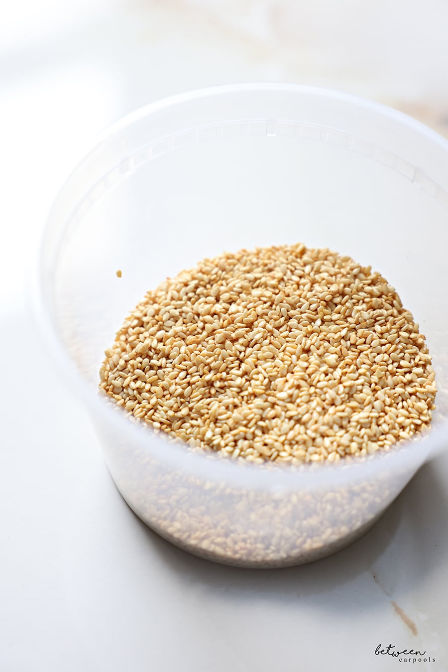 Roasted and cooled sesame seeds in an airtight container.