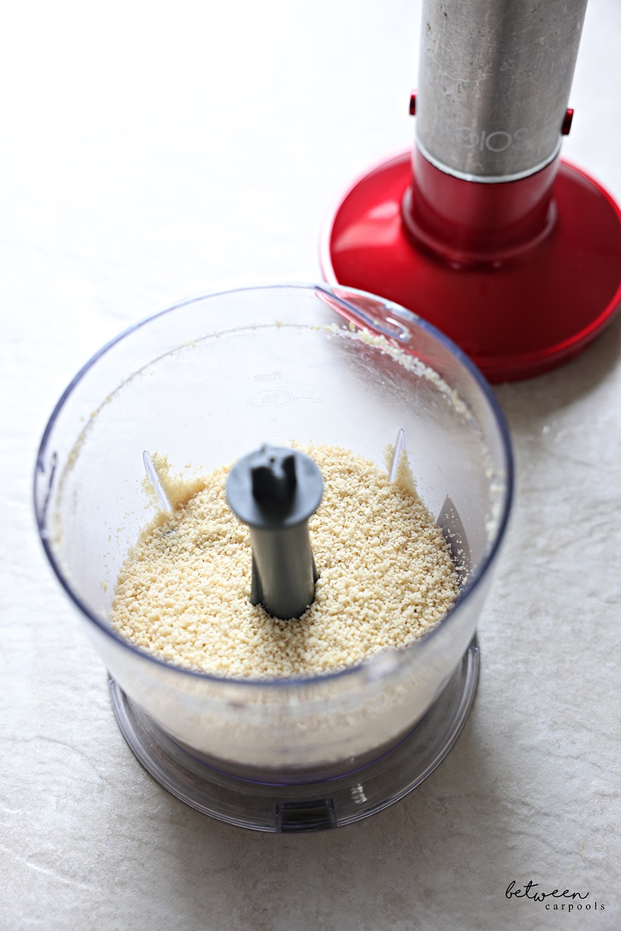 Ground cashews in a mini chopper.
