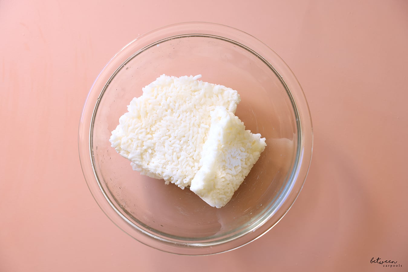 Ziploc bag of rice from freezer in a microwave safe glass bowl.