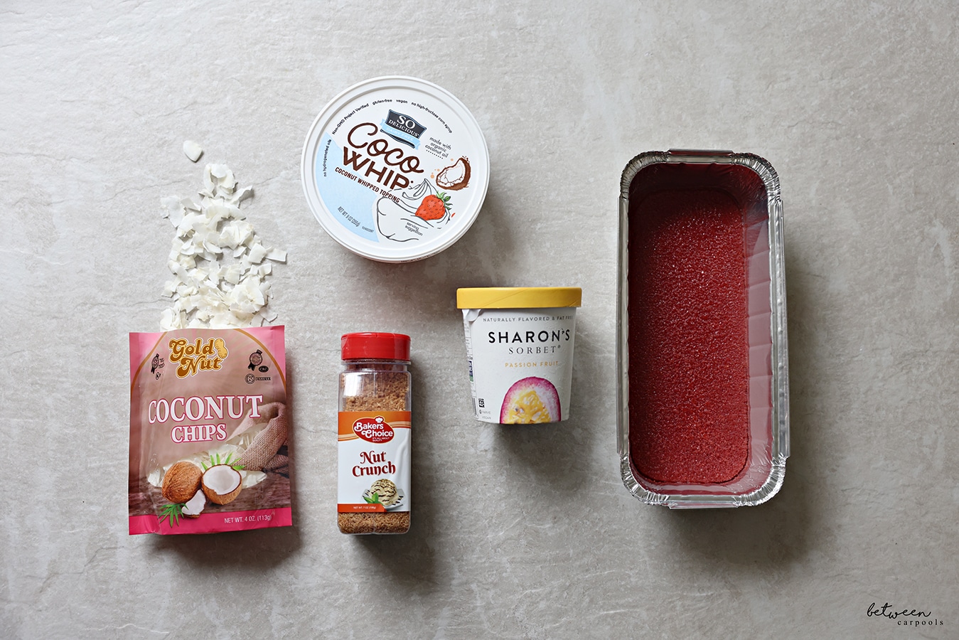 Ingredients layer out for Frozen Strawberry Passion Crunch dessert.