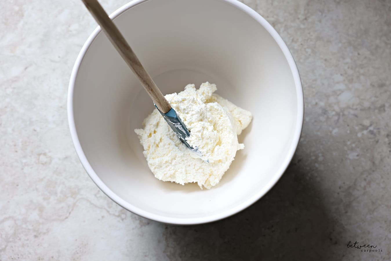Cheese mixture in a white bowl.
