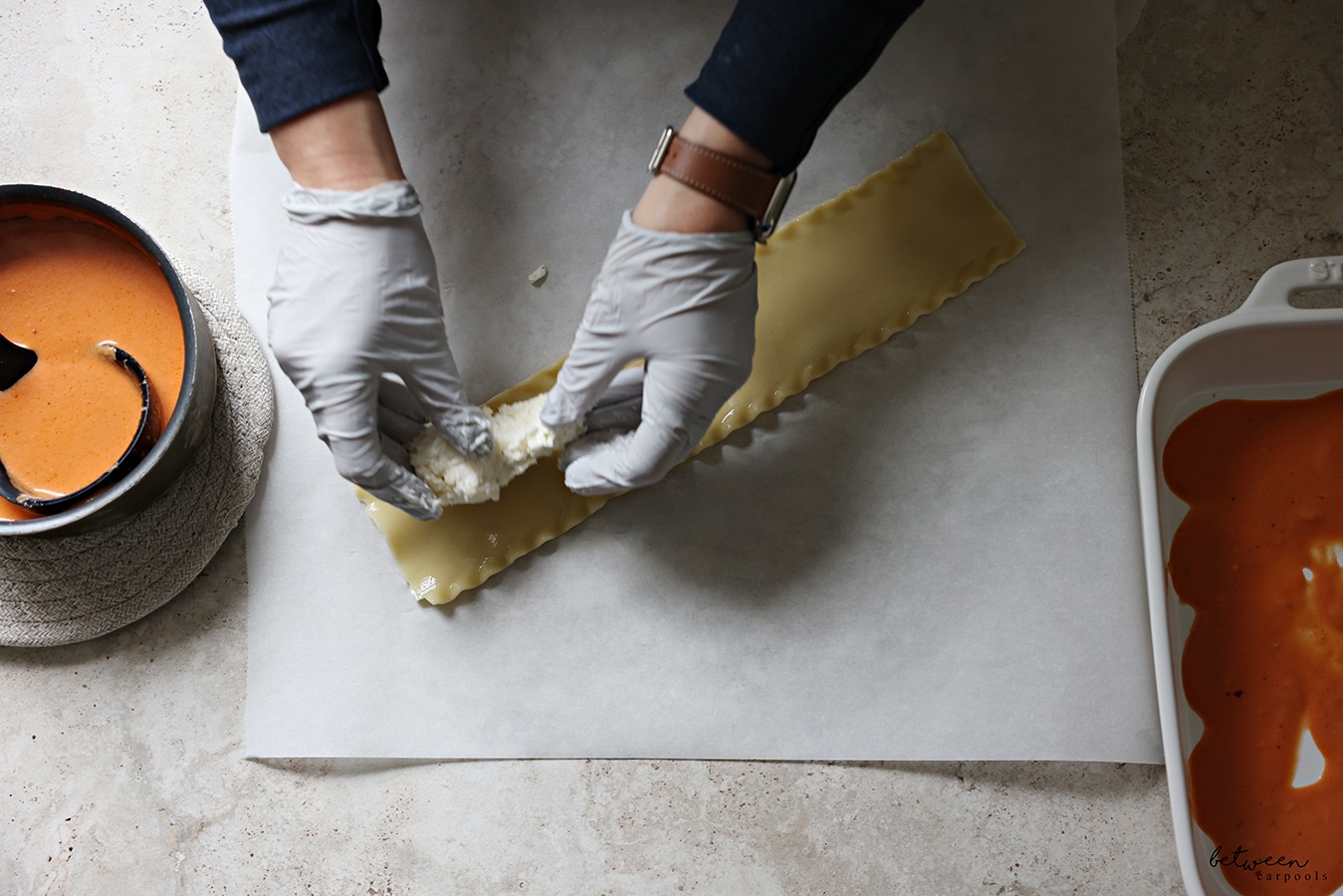 Lining the lasagna strip with the cheese mixture.