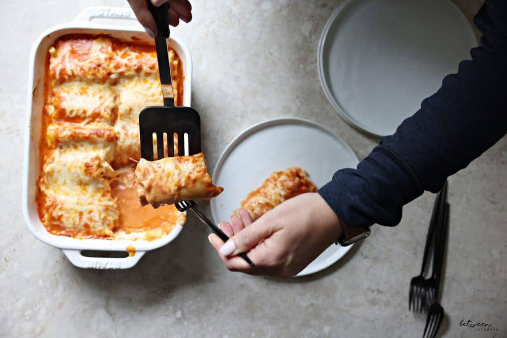 Serving and plating Lasagna Roll-Ups from a Staub baking pan.
