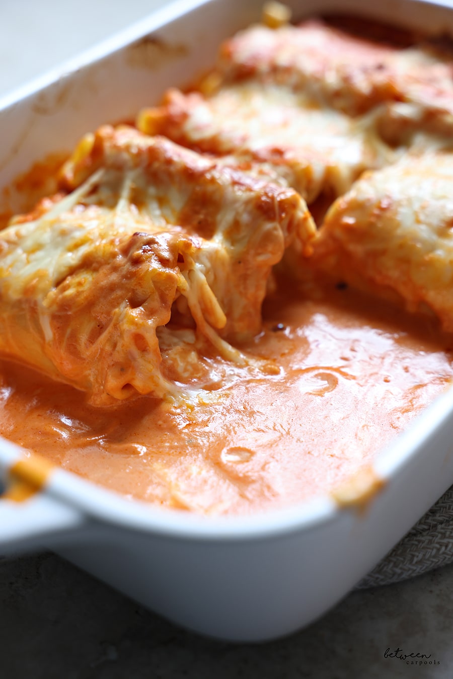 Lasagna Roll-Ups in a Staub baking pan.