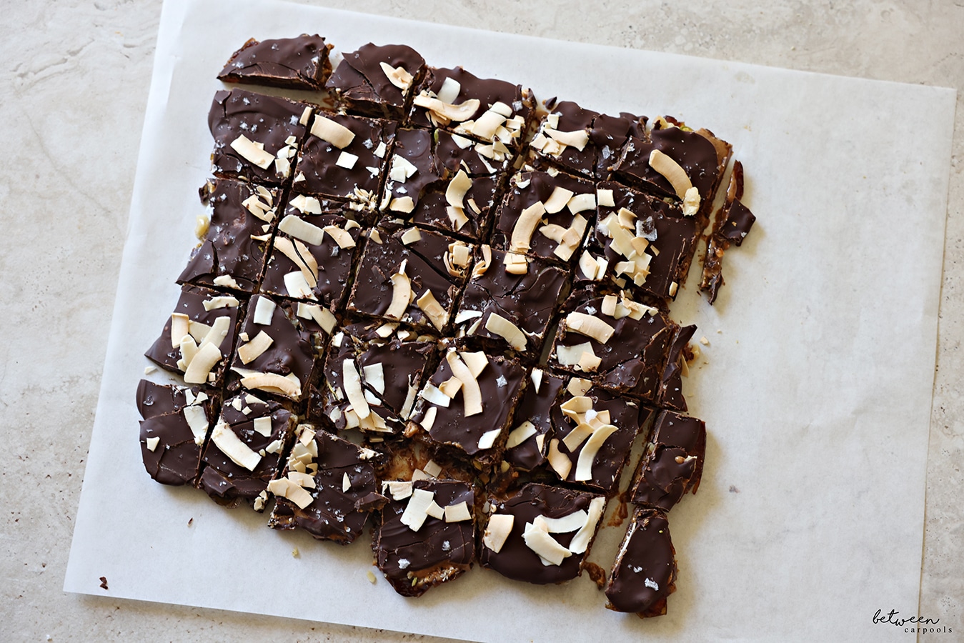 Date bark, sliced, on a piece of parchment paper.