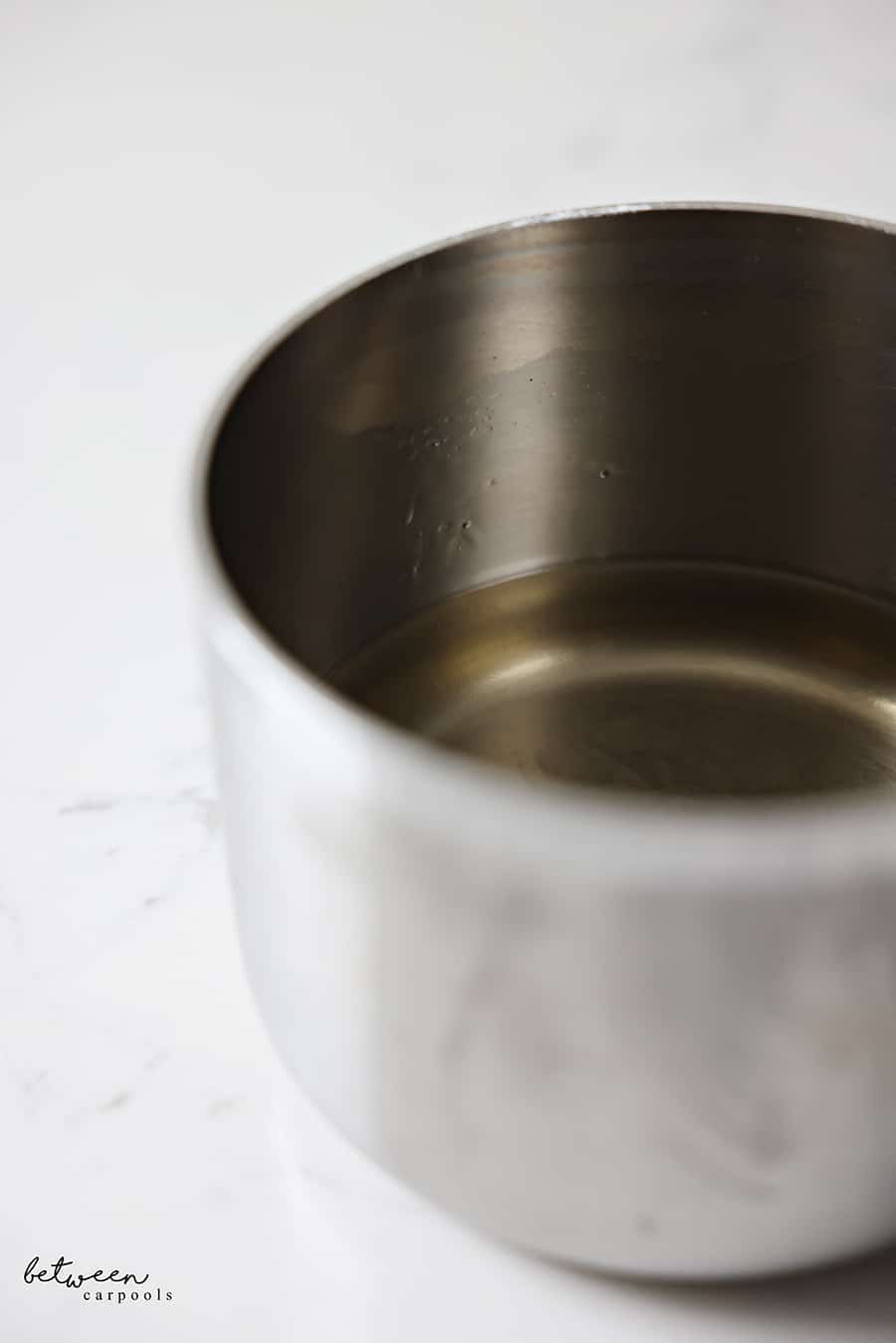 Simple syrup in a saucepan.
