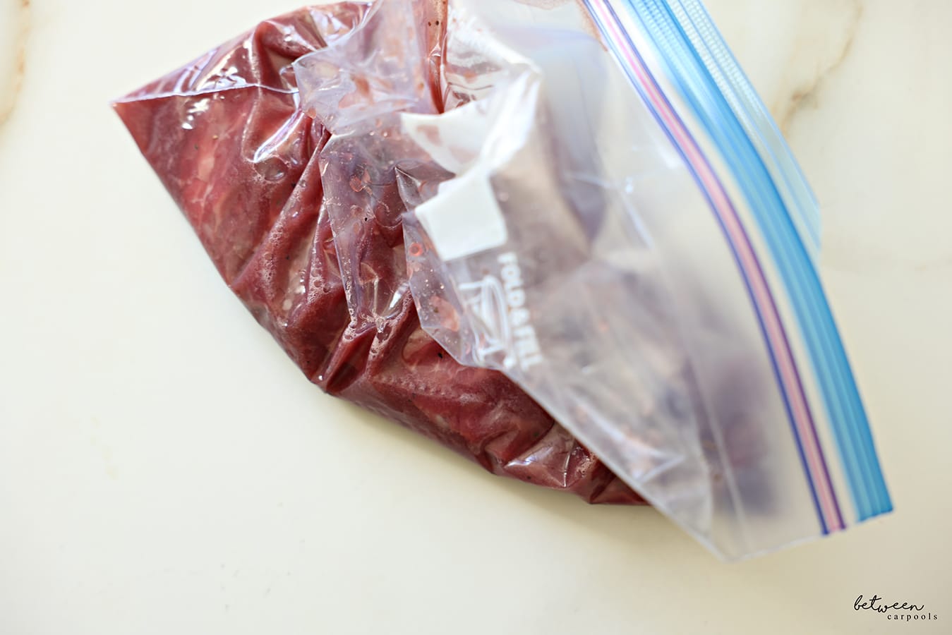 Strip steaks and marinade in a Ziploc bag.