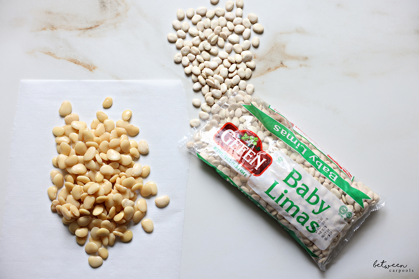 Bag of Gefen Baby Limas and some boiled lima beans on a piece of parchment paper.