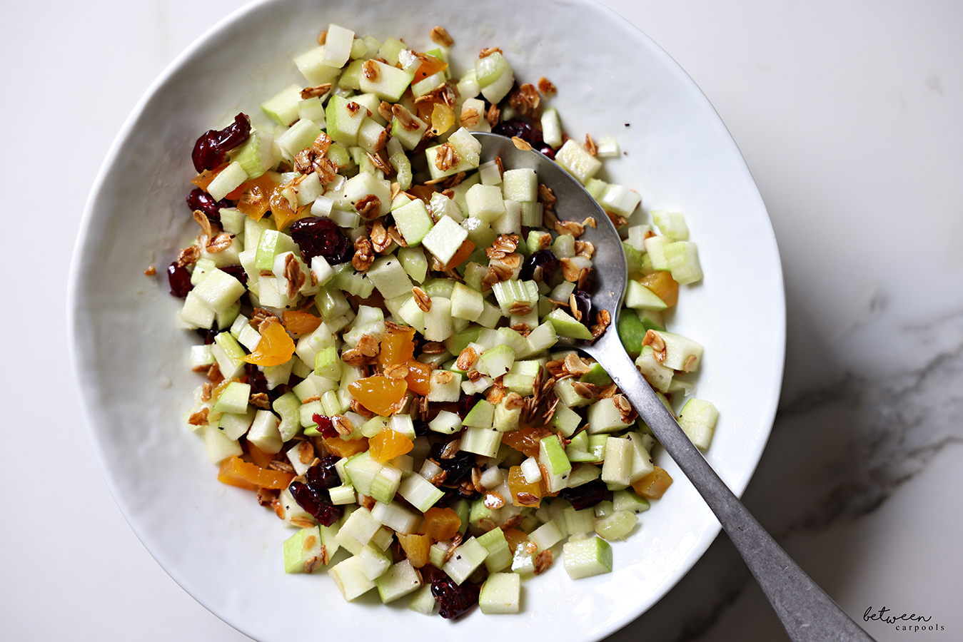 Bowl of Celery and Green Apple Salad tossed with olive oil, lemon juice, and maple syrup.