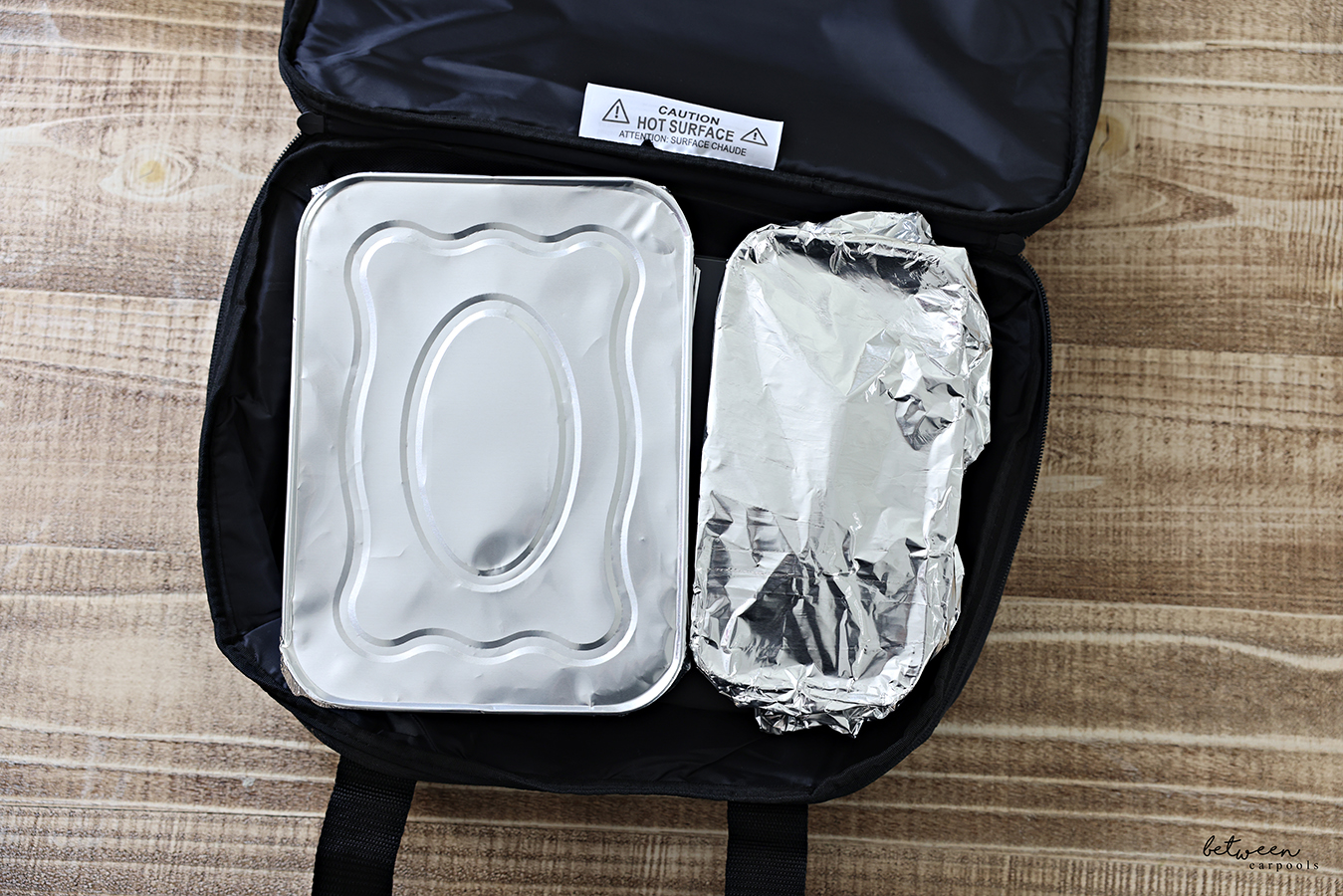 One half a 9×13 pan plus a loaf pan in a HOTLOGIC Max Large Portable Electric Food Heater. Open, Top View.