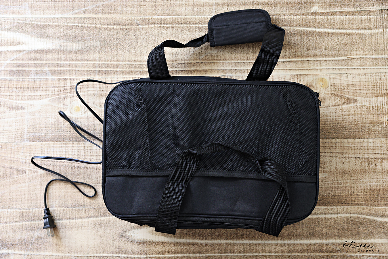 Three foil-covered disposable loaf pans with precooked food in a HOTLOGIC Max Large Portable Electric Food Heater. Closed, Top View.
