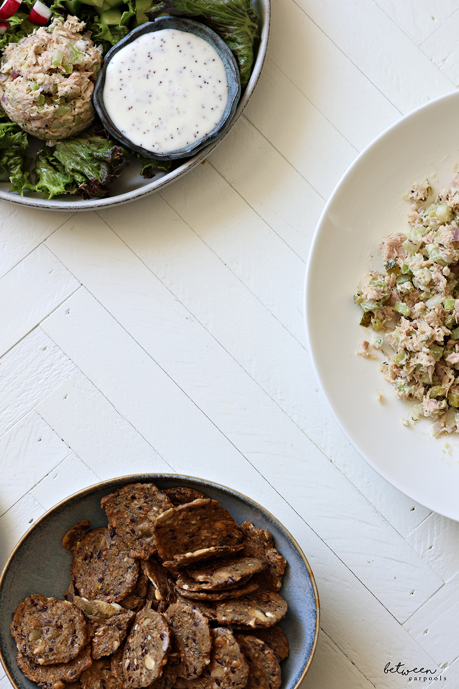Upgraded Tuna Salad, a salad with a scoop of tuna and Mary's Gone Crackers in bowls.