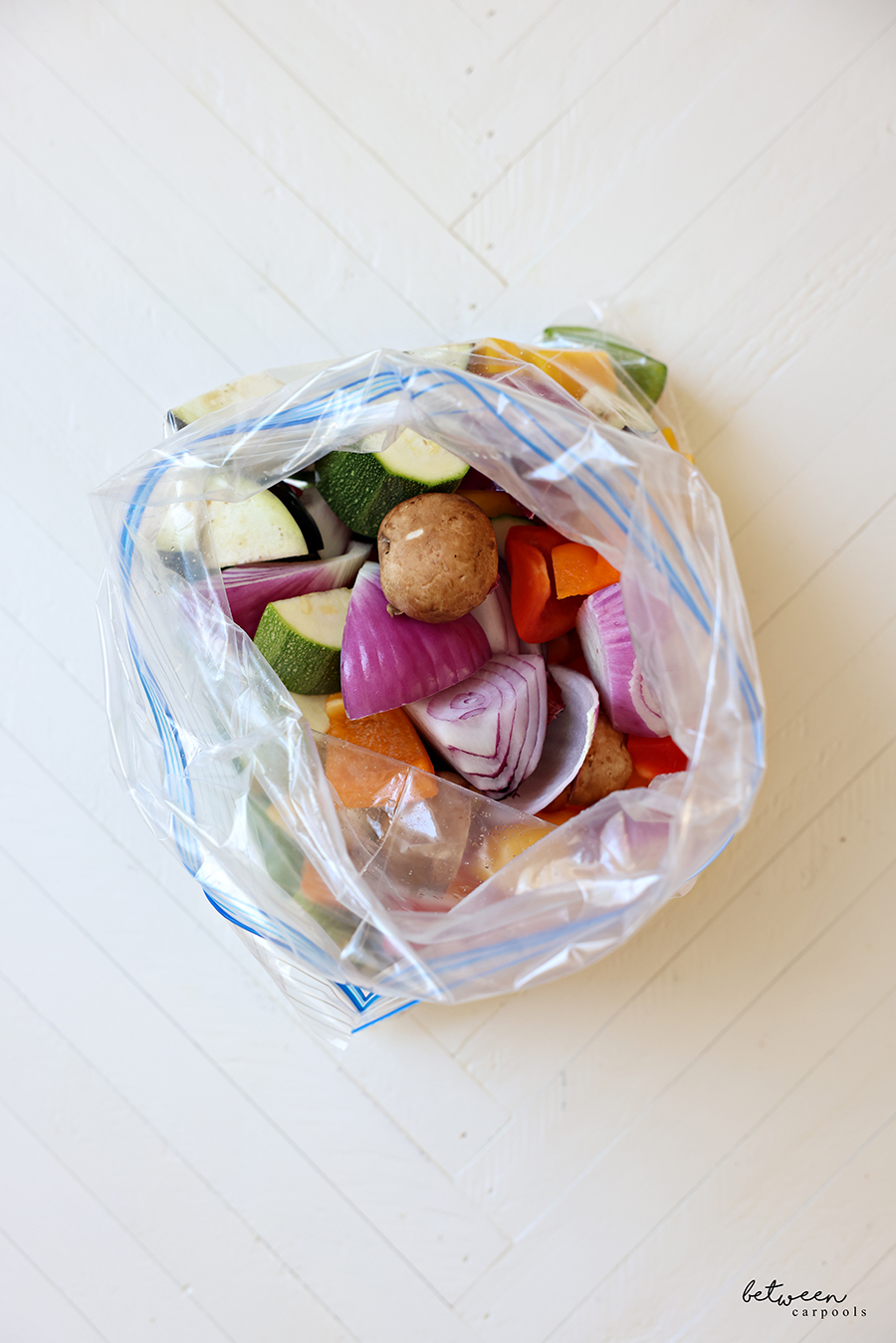 Large diced vegetables in a Ziploc bag.